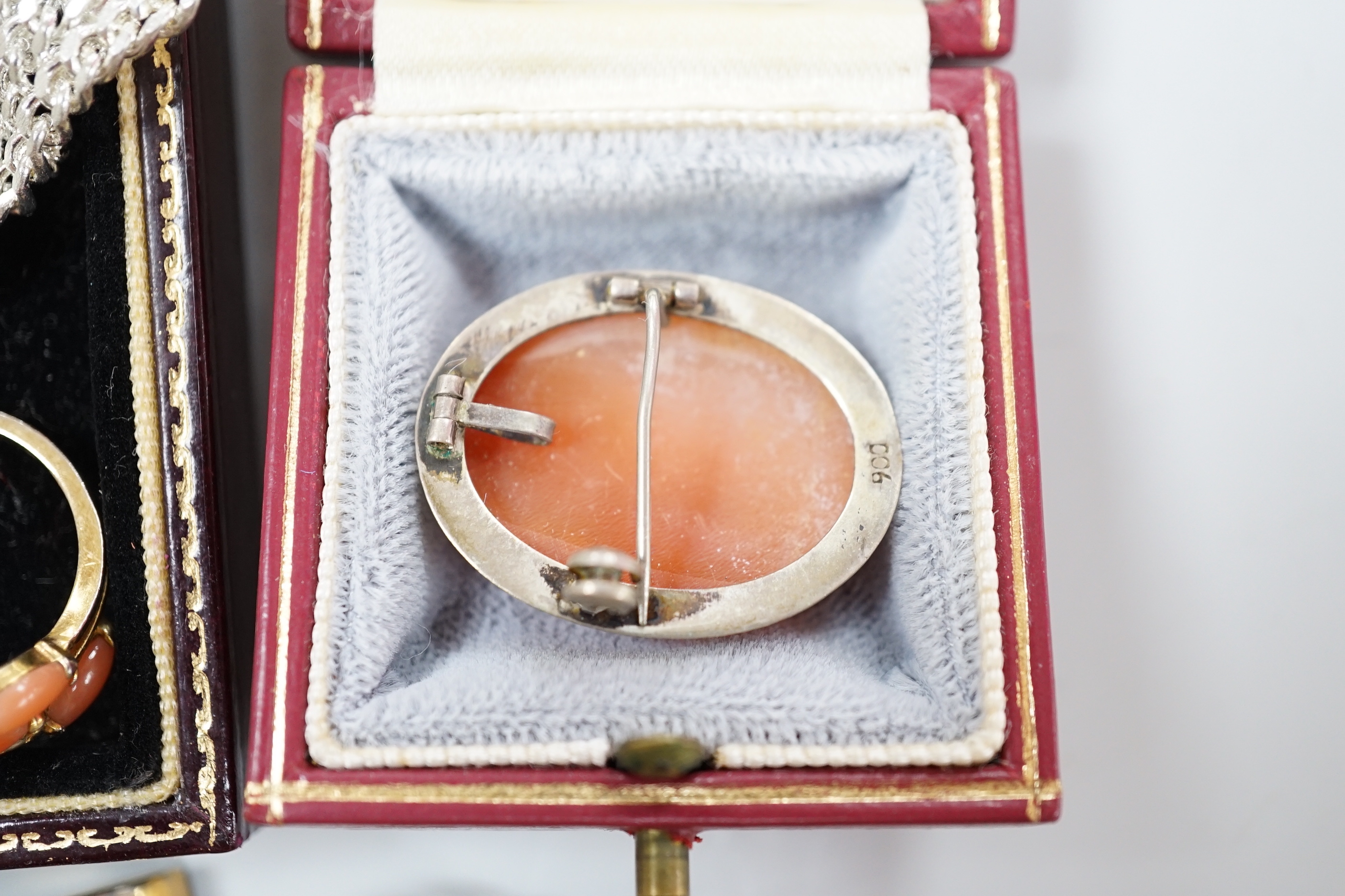 A group of assorted costume jewellery including a brooch in cameo corner leather case, and a small white card Cartier box